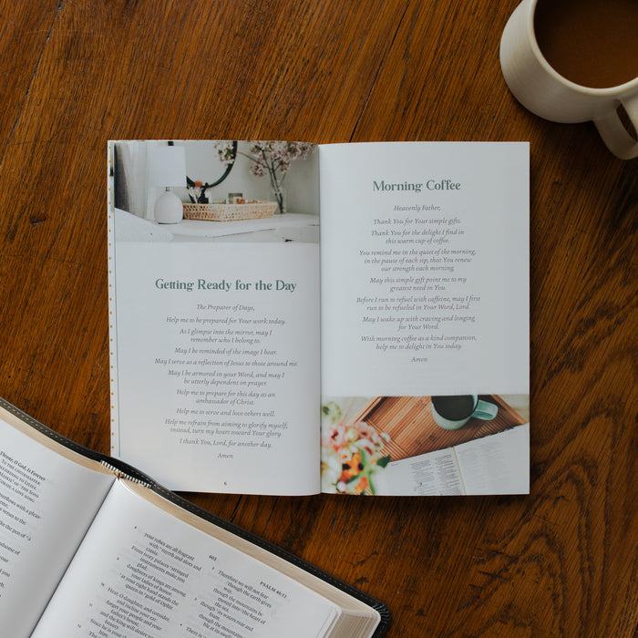 The Prayers for your Day opened to the Getting ready for the day page on a wooden table near a coffee cup
