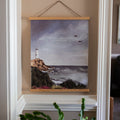 Psalm 119 Lighthouse Painting Print on a light colored wall with white trim