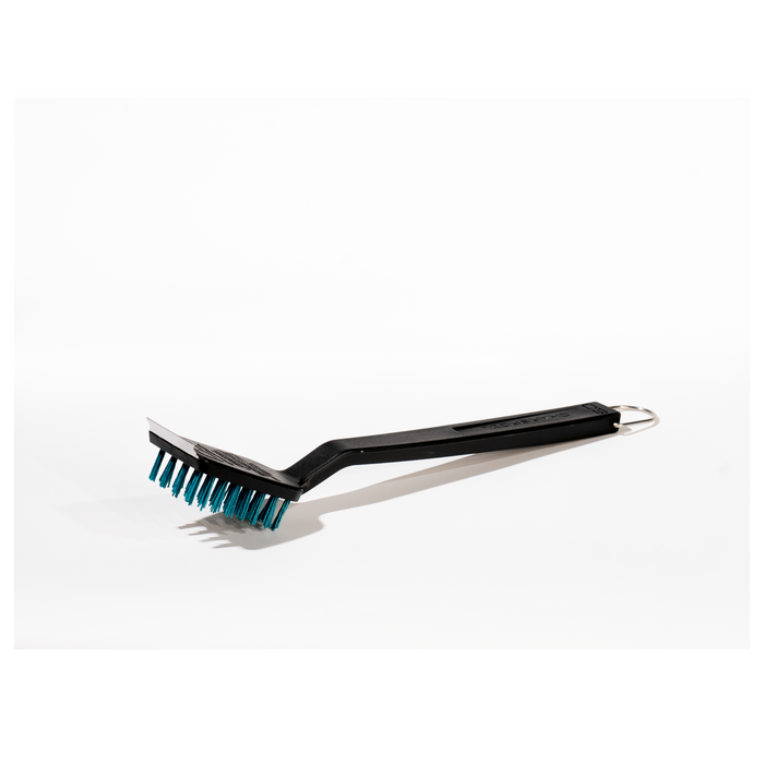 Black grill brush with teal bristles and metal handle.