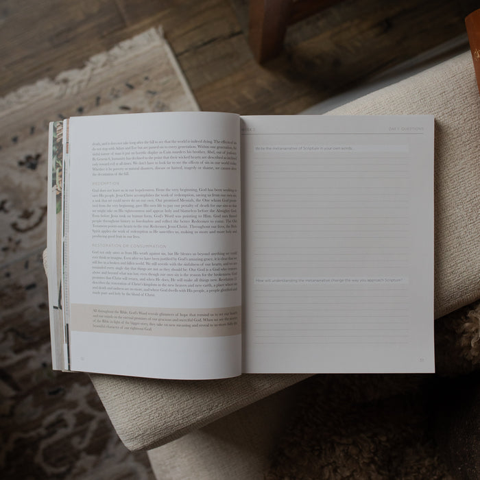 Open book on a textured surface with a blurred background