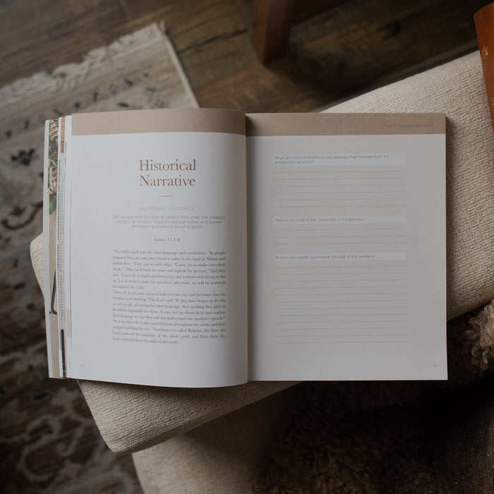 Open book on a wooden surface with visible text