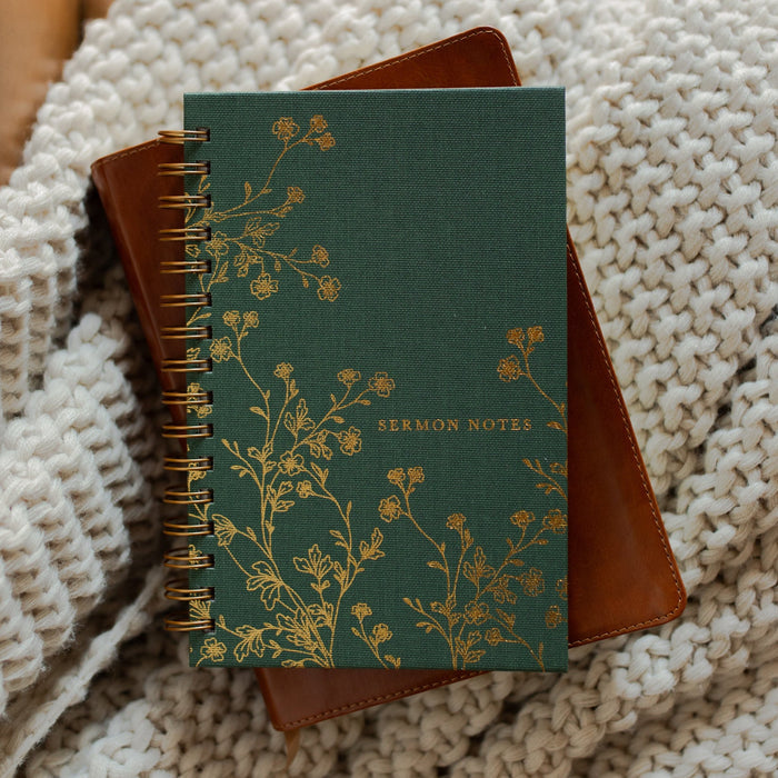 The Sermon Notes Journal with Green Floral on a bible and a knitted blanket