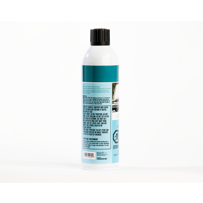 White aerosol can with teal label, safety warnings, and barcode.