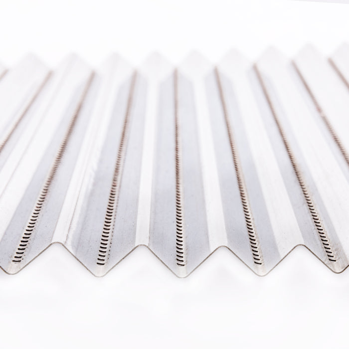 White corrugated plastic sheet with ribbed texture and small holes.