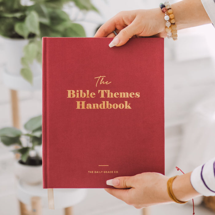 Woman holding handbook
