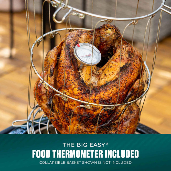 Roasted turkey in a metal basket with a food thermometer inserted. Text: "Food thermometer included."