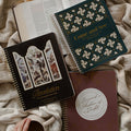Come and See Bible study, Revelation Study, and the Beyond a Shadow of a Doubt study on an open bible and a creme colored blanket