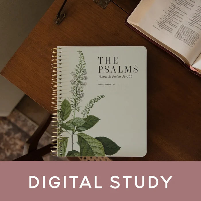 A spiral-bound book titled 'THE PSALMS Volume 2: Psalms 51-100' with a botanical illustration on the cover, placed on a wooden table next to an open Bible. A pink banner at the bottom reads 'DIGITAL STUDY'.
