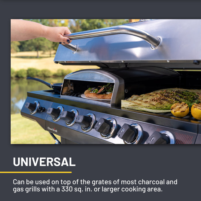 Silver Char-Broil grill with universal cooking modes, open lid showing food.