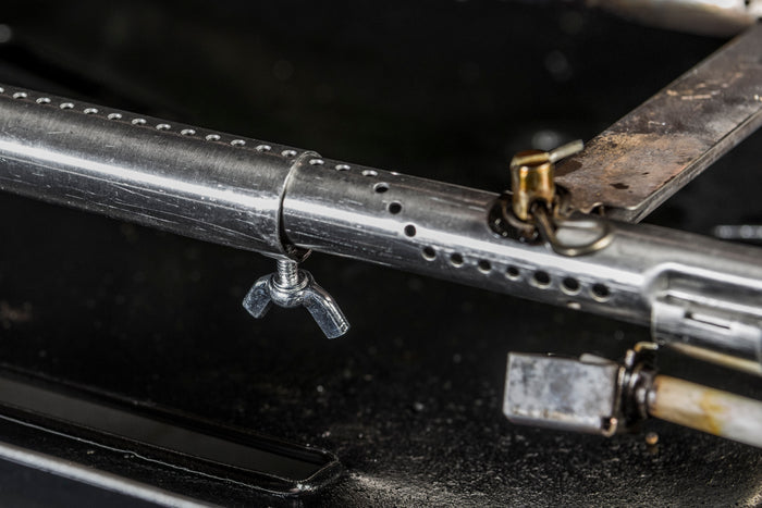 Silver firearm with exposed barrel and mechanism details.