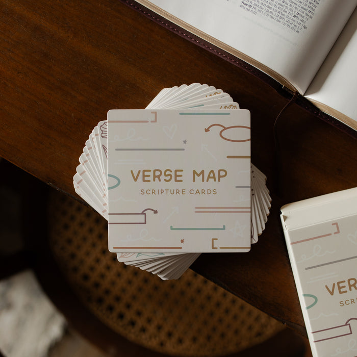 The Verse Map cards stacked on a wooden table in one stack