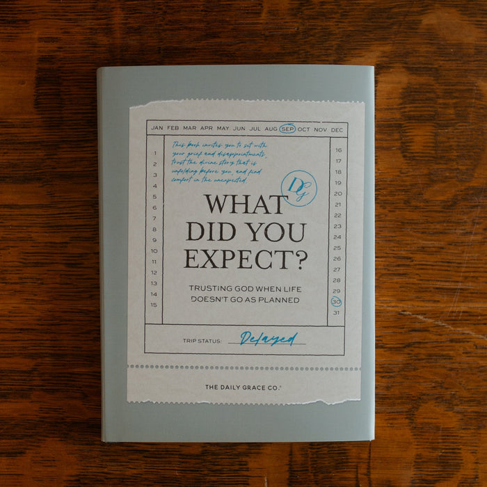 What did you expect book cover on a wooden table near a coffee cup