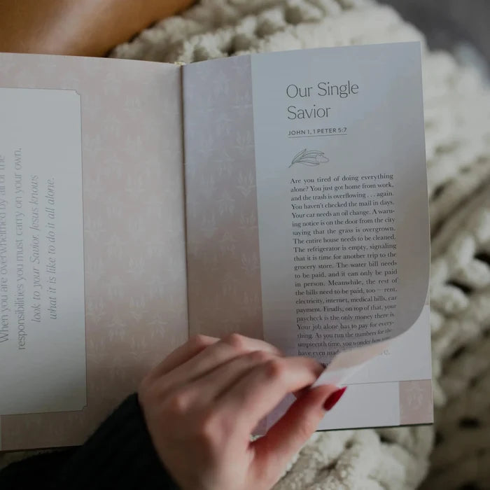 A woman turning a page in the You Belong Here Study